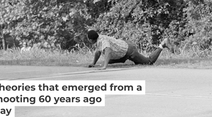 James Meredith looks at Aubrey Norvell, partially hidden behind foliage, after Norvell shot him in Hernando, Miss., on June 6, 1966. AP Photo/Jack Thornell
